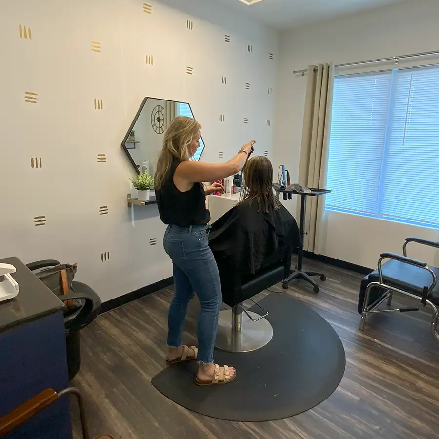 Posh Hair Beauty & Professional Studios - Stylist Amanda Trout cutting client's hair - Fairview Heights, IL